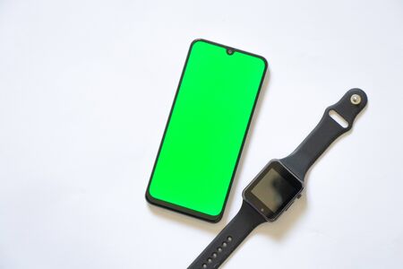 touchscreen phone with green screen and smart watchの写真素材