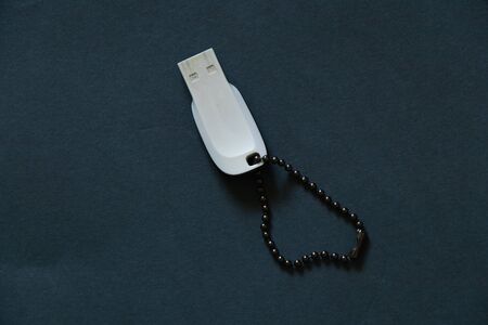 USB drive lies on a dark backgroundの写真素材