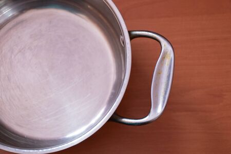 empty kitchen gray pan stands on a tableの写真素材
