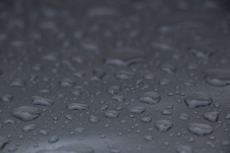 drops of water on a dark gray backgroundの写真素材