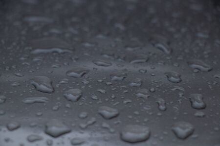 drops of water on a dark gray backgroundの写真素材