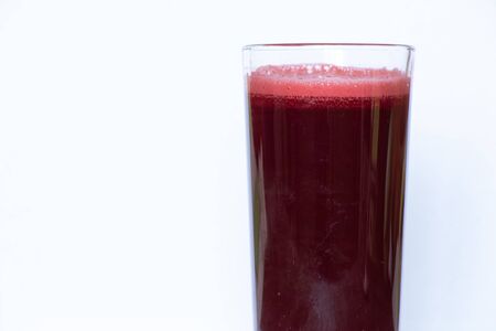 fresh beet juice in a jar on a tableの写真素材