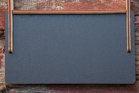 empty little school blackboard with place for text stands outdoorsの写真素材