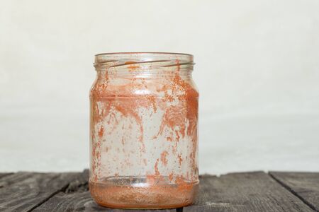a glass of dirty juice stands on the kitchen tableの写真素材