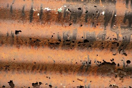 rusty holey fence as background