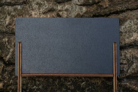 schoo wooden blackboard with place for text stands in the forestの写真素材