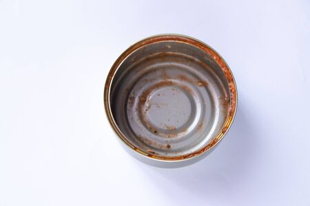 dirty tin can after eaten sprats on a whiteの写真素材