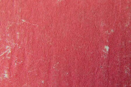 old light red background book cover macroの写真素材