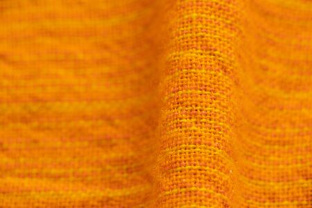 orange plain fabric as a backgroundの写真素材