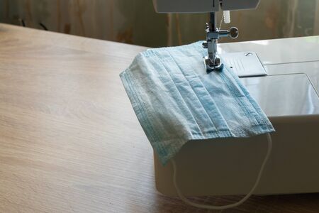 new sewing machine sews a medical mask during a pandemicの写真素材