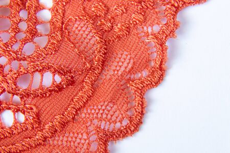 orange lace openwork on a white backgroundの写真素材