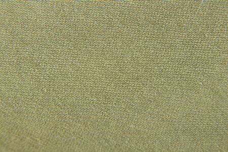 green fabric dress as background macroの写真素材