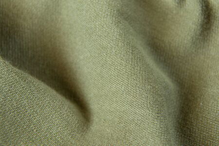 green fabric dress as background macroの写真素材