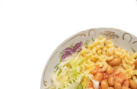 pasta and cabbage on a plate on a white backgroundの写真素材