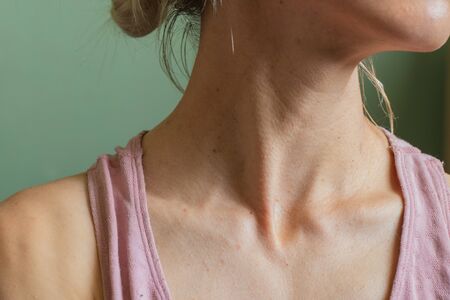 neck of a Ukrainian girl close-up isolated backgroundの写真素材