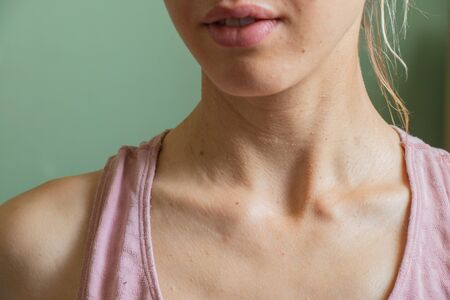 neck of a Ukrainian girl close-up isolated backgroundの写真素材