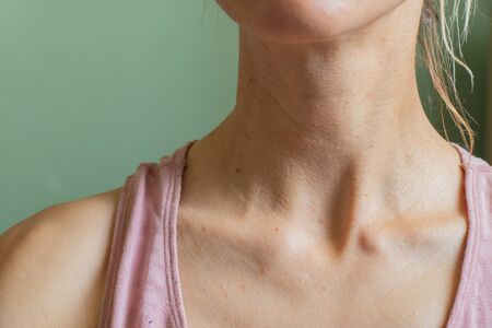 neck of a Ukrainian girl close-up isolated backgroundの写真素材