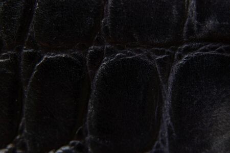 black genuine leather as background close up
