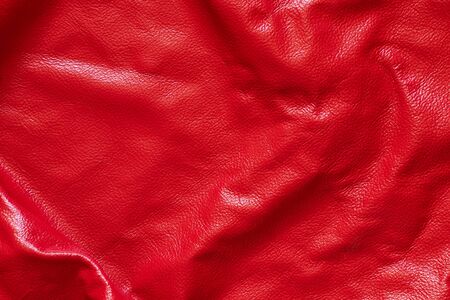 dark red genuine leather as a close up backgroundの写真素材