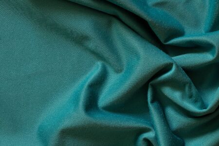 plain dark blue crumpled fabric as a background close upの写真素材
