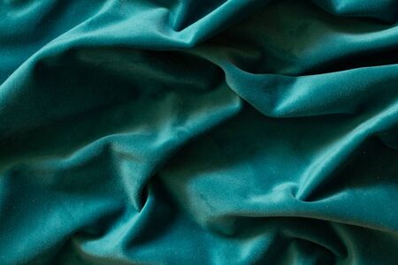 plain dark blue crumpled fabric as a background close upの写真素材