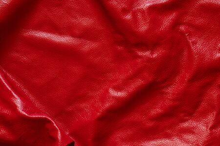 dark red genuine leather as a close up background