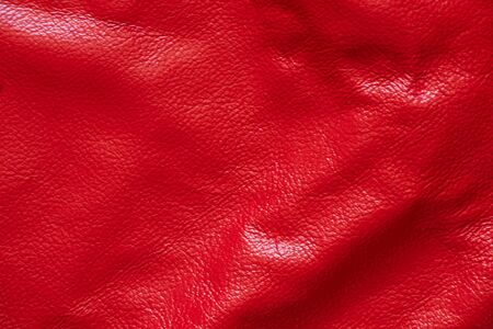 dark red genuine leather as a close up backgroundの写真素材