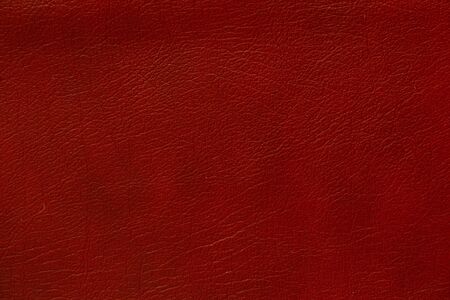 dark red genuine leather as a close up backgroundの写真素材