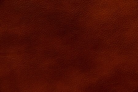 dark red genuine leather as a close up backgroundの写真素材