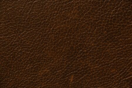 dark red genuine leather as a close up backgroundの写真素材