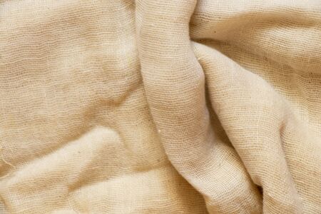 gauze crumpled fabric light as a backgroundの写真素材