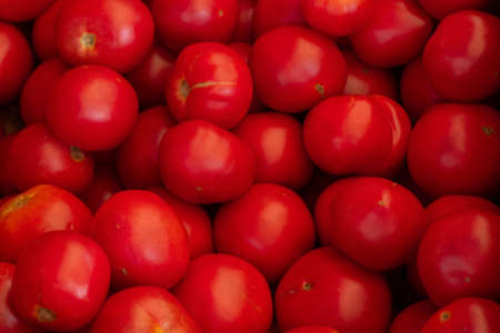 tomatoes in the bazaar in a crate as a background close upの写真素材