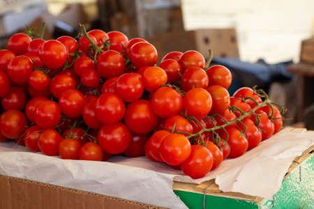 cherry tomatoes in a bazaar in a shop window in Ukraineの写真素材