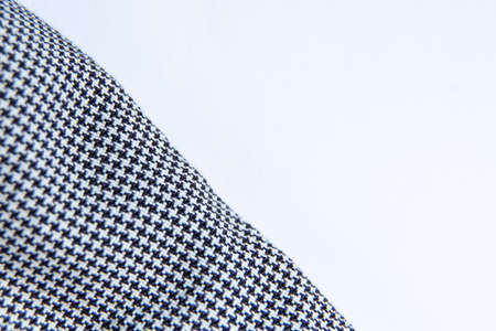 black and white checked fabric with place for text on a white backgroundの写真素材