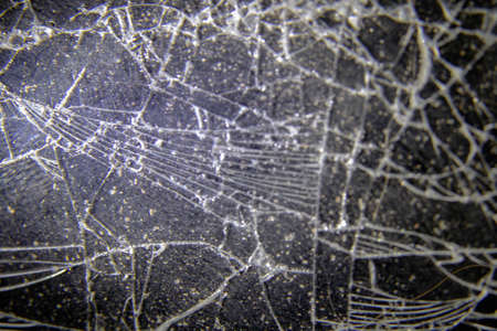 broken glass on a dark background macroの写真素材
