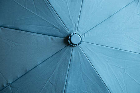 light blue umbrella as a background close upの写真素材