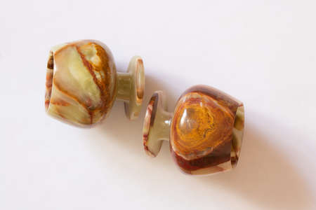 a glass of onyx stone on a colored background close upの写真素材