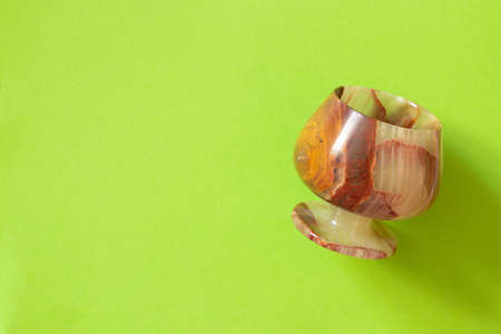 a glass of onyx stone on a colored background close upの写真素材