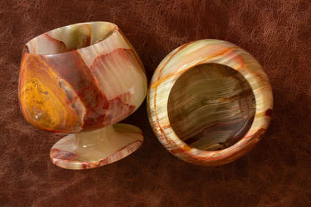 a glass of onyx stone on a colored background close upの写真素材