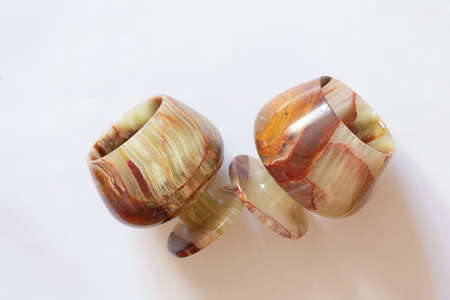 a glass of onyx stone on a colored background close upの写真素材
