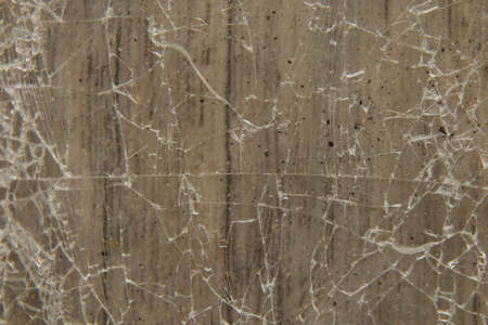 broken glass on a brown background close-upの写真素材