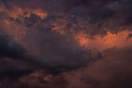 dark clouds in the evening in pink in Ukraine as a backgroundの写真素材