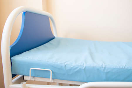 blue hospital couch in the ward of the Ukrainian hospital in the city of dnipro in quarantineの写真素材