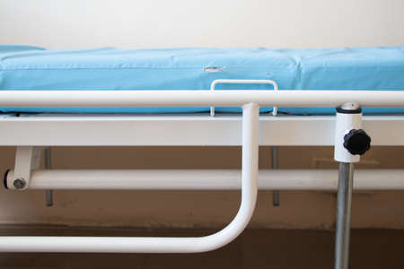 blue hospital couch in the ward of the Ukrainian hospital in the city of dnipro in quarantineの写真素材