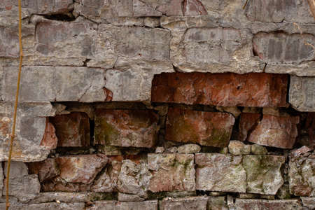 old brick wall of ruined house as background