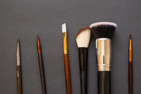 makeup brush on a dark background close-up