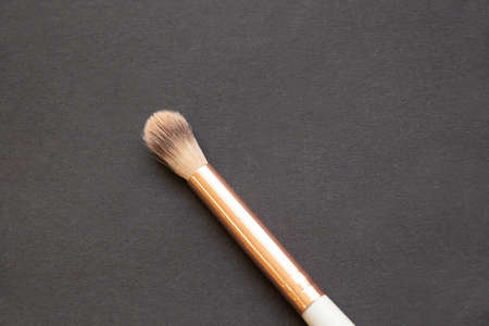 makeup brush on a dark background close-upの写真素材