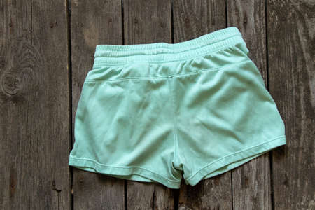 womens shorts lay on rustic brown background, womens clothing, fashionの写真素材