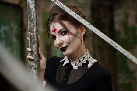 portrait of a girl with makeup for halloween carried bars on the street, people for halloween