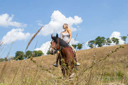 horse ride with a model on a horse in Ukraine in summerの写真素材